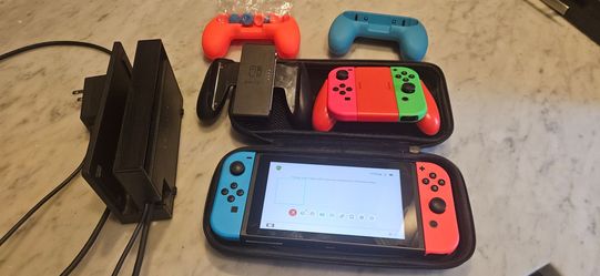 Switch 1 with dock, case, and 2 controllers. New battery installed, SD card reader does not work