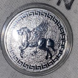 The "Remember The Alamo 1 Oz .999 Silver Round" is a silver bullion coin with a high level of purity at 0.999 fineness. This coin contains 1 ounce of 