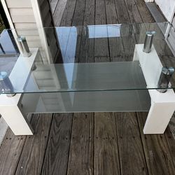 Like new Glass table with underside glass storage