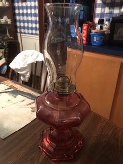 Rose colored oil lamp