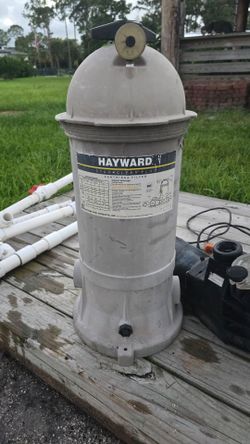 Hayward pool pump and filter, plus robot vacuum and ladder for above ground pool.
