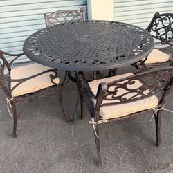 Patio,Outdoor furniture,Table,4 Chairs with cushions.