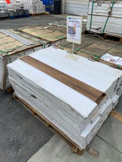 Boxes or pallets of Glue down vinyl flooring Gray or Brown $15per box 40 sq. Ft. Or $200 per pallet 2200 sq. Ft .