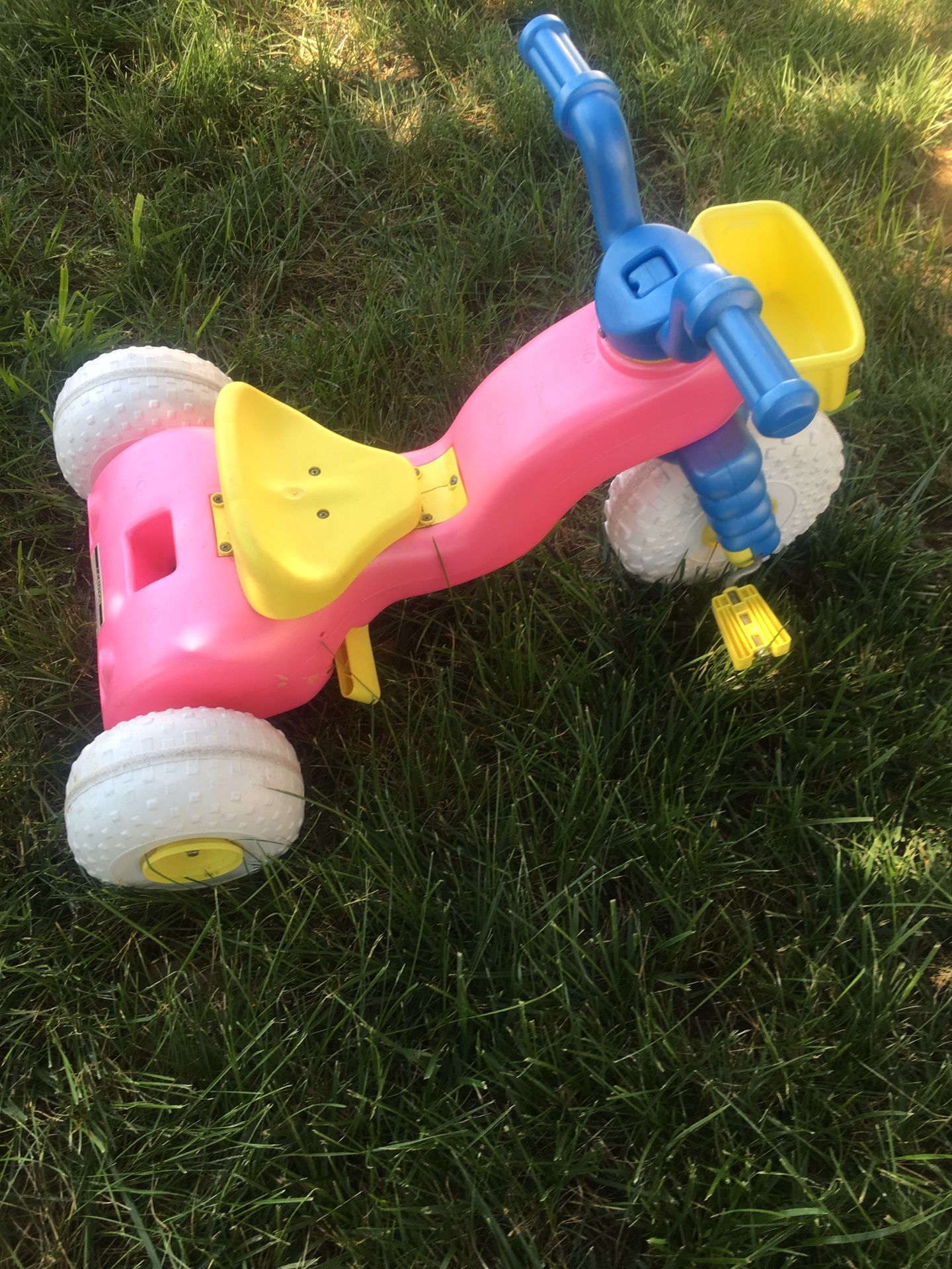 Little kids ride on toy with a push handle. Handle is not photographed .