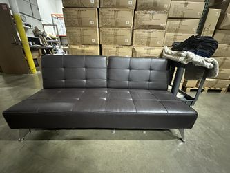Faux leather sofa that Adjusts To Day Bed 