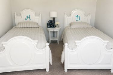 Two Twin White Wooden bed sets with mattresses