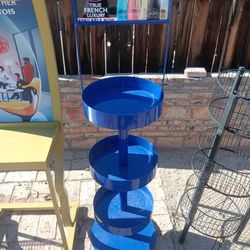 Brand new circle blue Rack with wheels on the bottom right now. Help you sell your product.