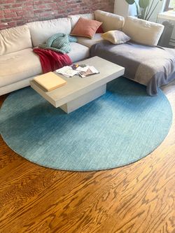 Modern blue circular wool rug