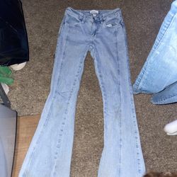 Light Blue Jeans With Stars On The Back 