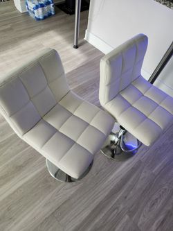 2 white bar stools