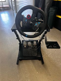 Logitech PlayStation steering wheel controller with frame and pedals