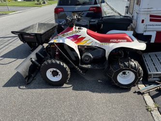 Polaris 400 4x4 with plow and utility trailer