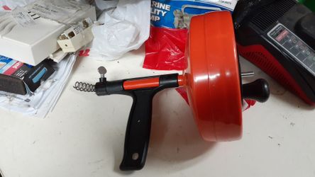 Portable drain cleaner with drill attachment