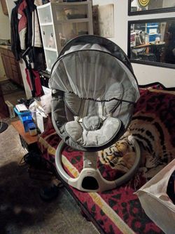 Babies with rocker and swivels and plays music up and down side to side