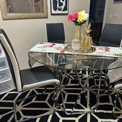 Black And With  Chairs And Dining Table 