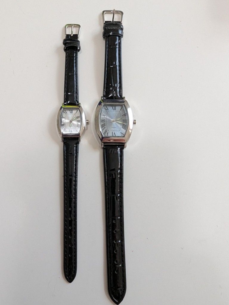 New His and hers stylish watches with black leather straps and silver dials. Both of these watches are new.