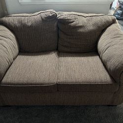 2 brown couches