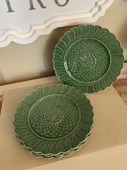 4 embossed green plates