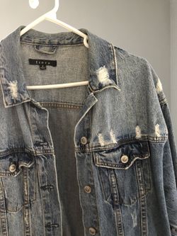 Oversized distressed jean jacket SIZE SMALL. (I would say fits like a medium since it’s oversized)