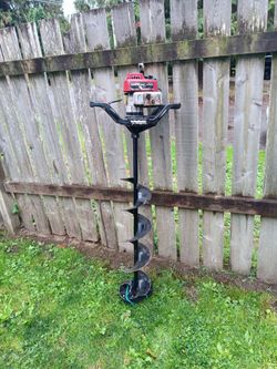 gas powered 2 stroke ice auger drill with 8" bit and its 53 ins high runs great