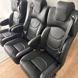  three Captain's chairs with swivel, recline and slide functions. 