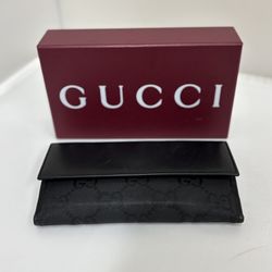 Black Gucci wallet in original box. 