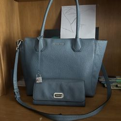 Michel Kors blue purse with matching blue wallet 