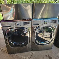 LG FRONT LOAD WASHER AND GAS DRYER SET WITH PEDESTALS 
