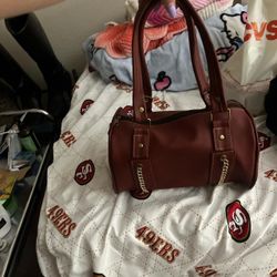 Brown purse with gold chains