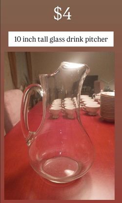 10 inch tall glass pitcher,  set of drinking glasses and a set of glass drinking mugs