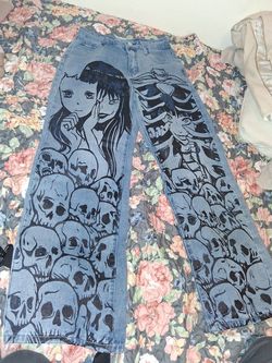 These jeans are the ROMWE Anime Figure Graphic Straight Leg Jeans featuring a distinctive skull and character print.