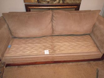 Tan couch and loveseat