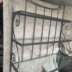 Wrought iron Baker rack is in good condition 