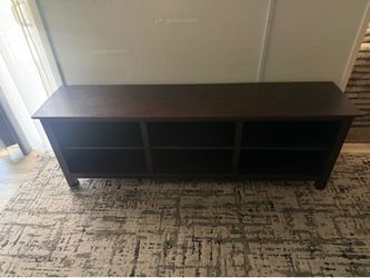 Long tv stand had a 86 inch on it