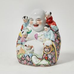 A Chinese porcelain model of Budai 