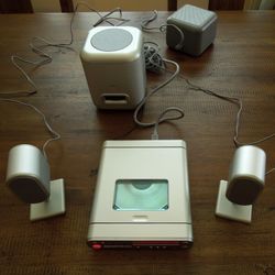 Brookstone CD/AM/FM/AUX Micro Speaker System MS1
2.1 
Sounds great