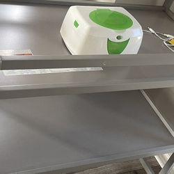 Baby changing table and warming wipes device