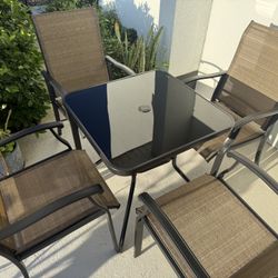 Table and 4 chairs 
