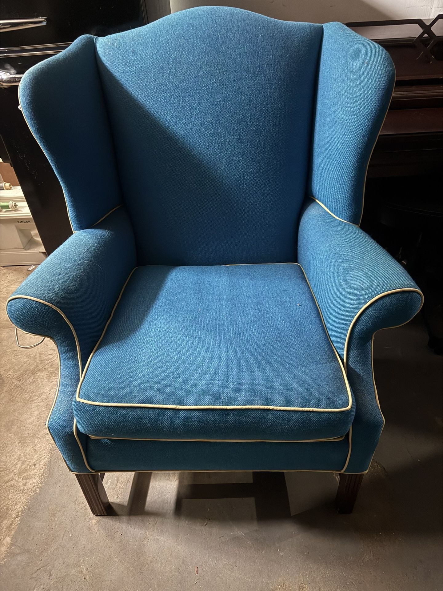 Blue Wingback Armchair With Yellow Piping