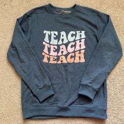 Teacher sweatshirt. Size medium. Pastel.