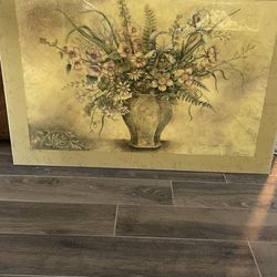 Hanging picture of vase with flowers