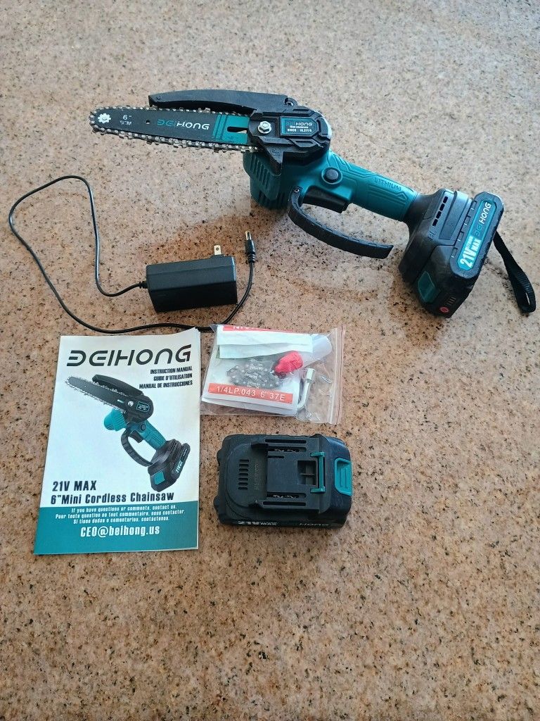 6 Inche mini chainsaw. Everything works. $40