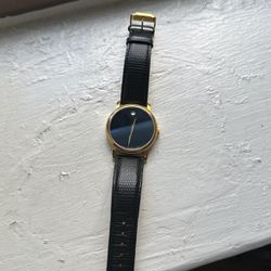 Black And Gold Movado watch 