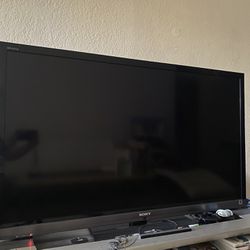 Sony TV and Glass Stand 