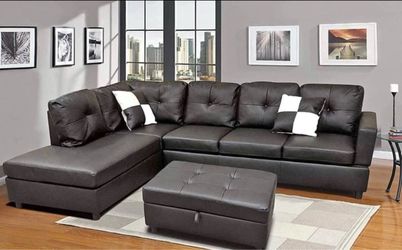 Black leather sectional couch with drop down table