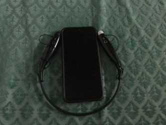 Samsung A20 with headphones and case