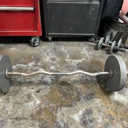 Olympic Curl Bar And Two 25 Pound Plates