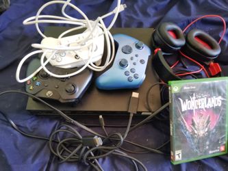 Xbox one x 1tb 3 controllers, 2 games and a headset