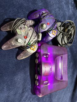 Clear Purple Nintendo 64 W expansion pak and 2 controllers