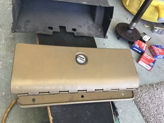 69 Camaro original glove box door, original yellow gold color,And glove box box..$100..fits nova